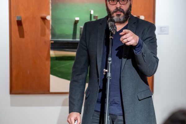 Person reading poem at an open mic event