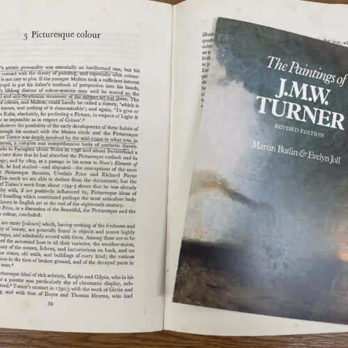 open book with pamphlet by turner lying on it