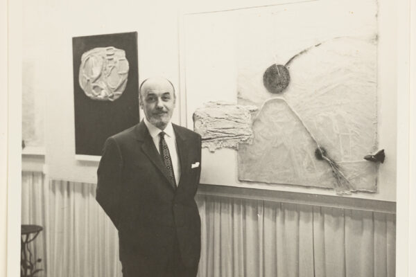 Emvin Cremona next to work, courtesy of The Cremona Family Archives